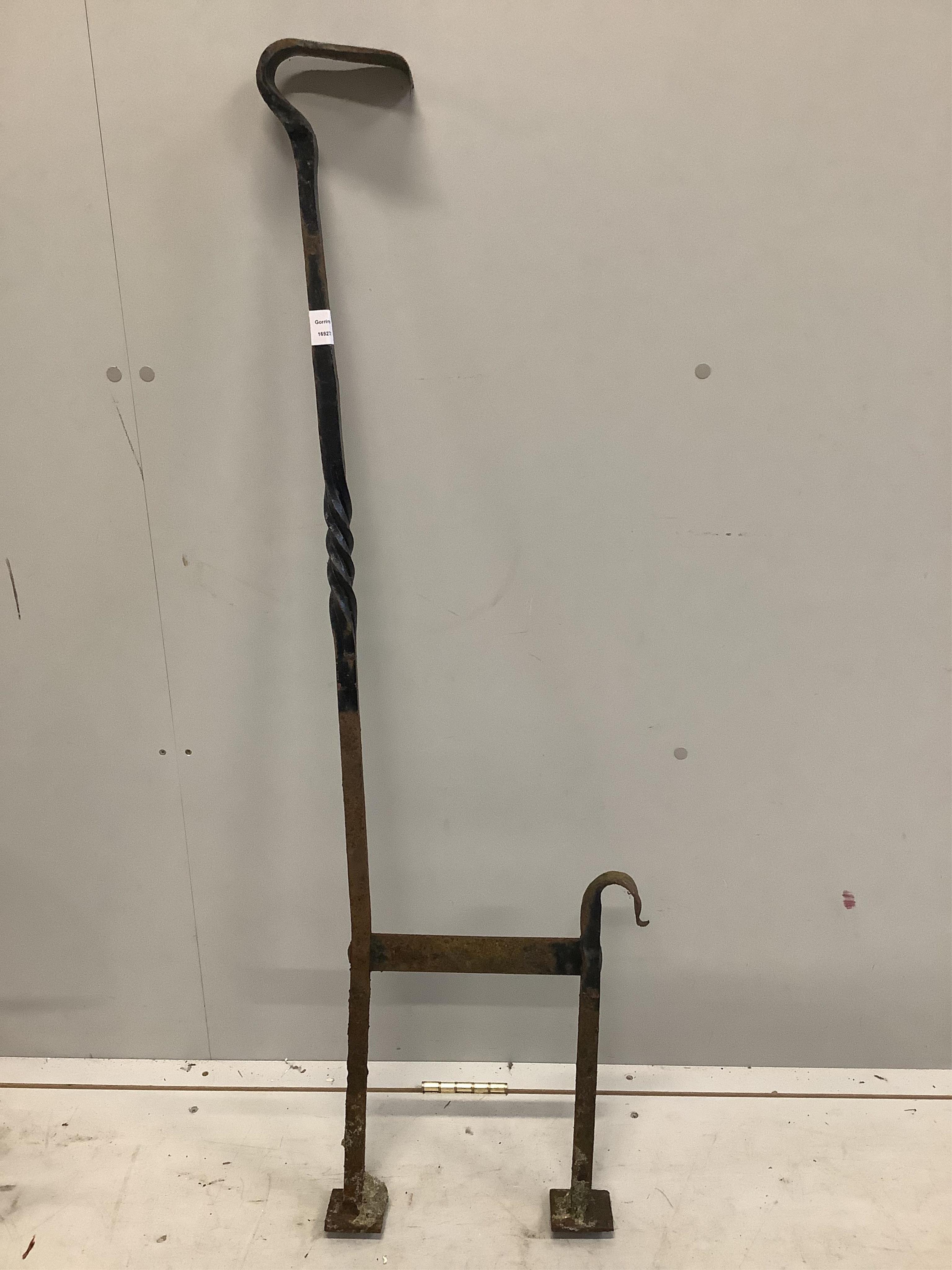 A wrought iron boot scraper, height 122cm together with a hose reel stand. Condition - poor to fair